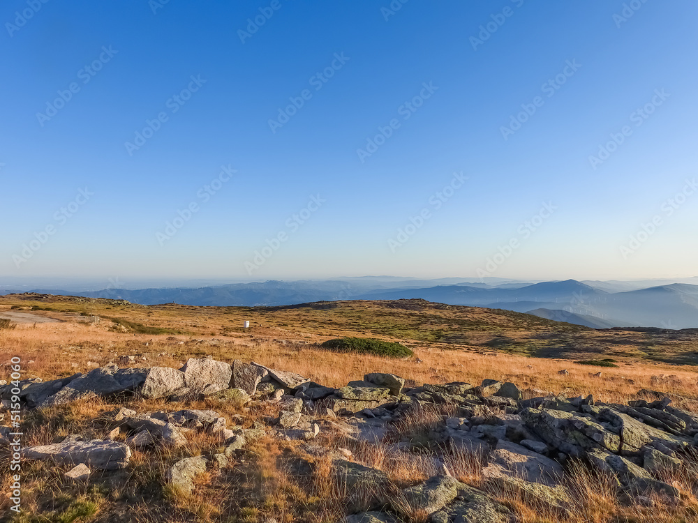 Mountain landscape at Torre, Serra da Estrela, Portugal. View of the mountain chain and golden grass.