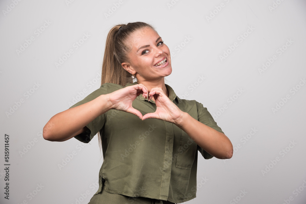 Portrait of woman giving heart to someone Portrait of woman giving heart to someone