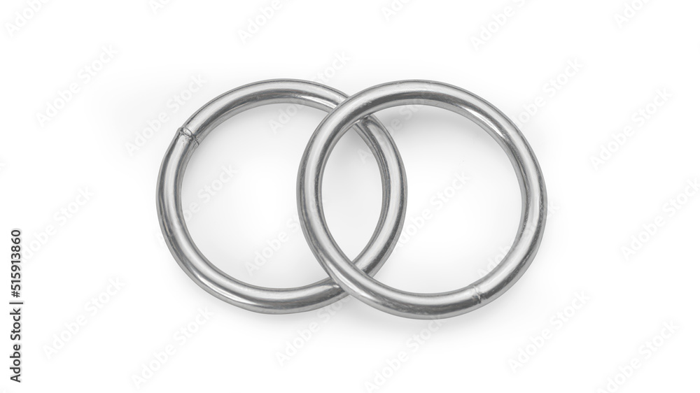 Two crossed silver colored crossed metallic rings isolated with clipping path Two crossed silver colored crossed metallic rings isolated with clipping path