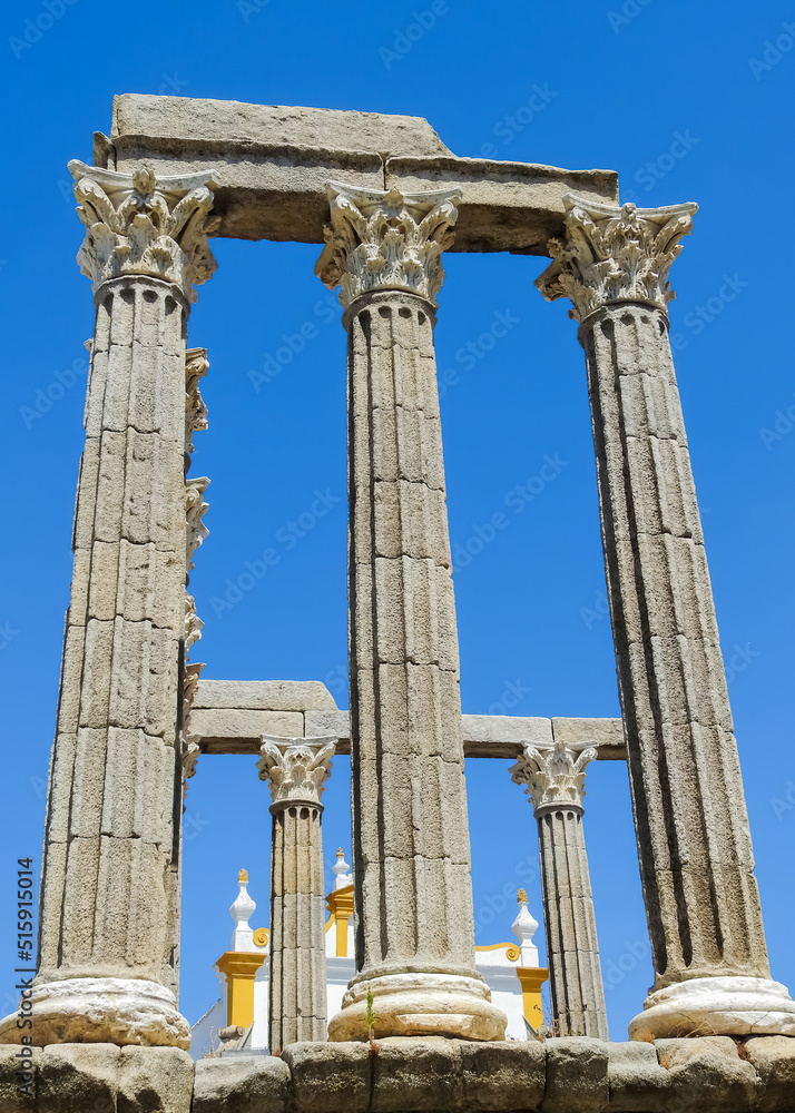The Roman Temple of Evora, also called the Temple of Diana. Behind it, The Cathedral of Evora. Contrast of two different time periods.
