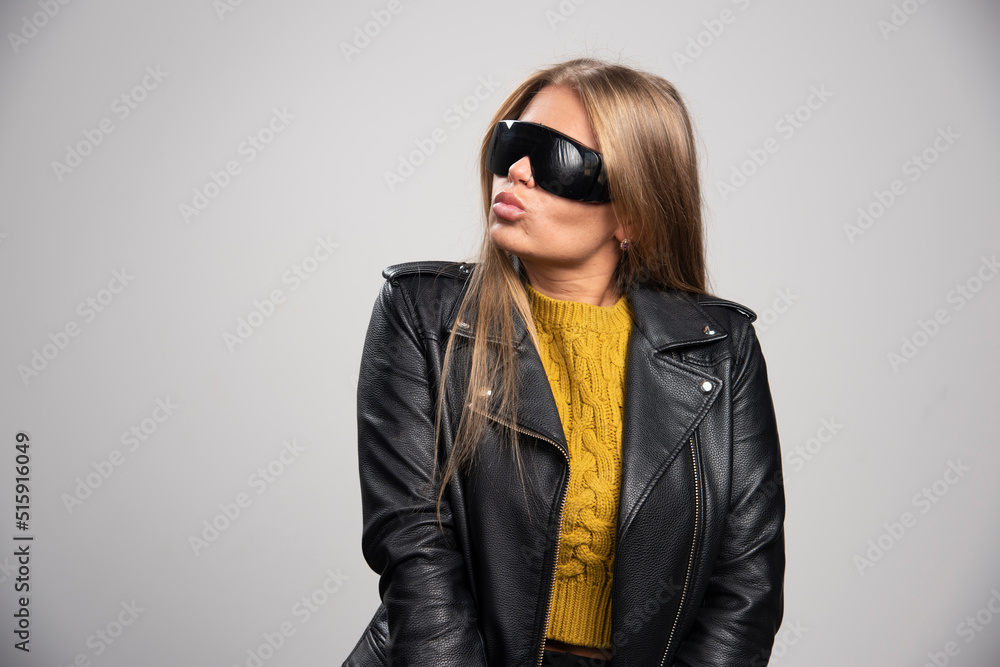 Blonde celebrity in black sunglasses looks confident and proud of herself Blonde celebrity in black sunglasses looks confident and proud of herself