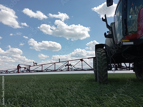 Special tractor for the treatment of crops from weeds and pests. photo