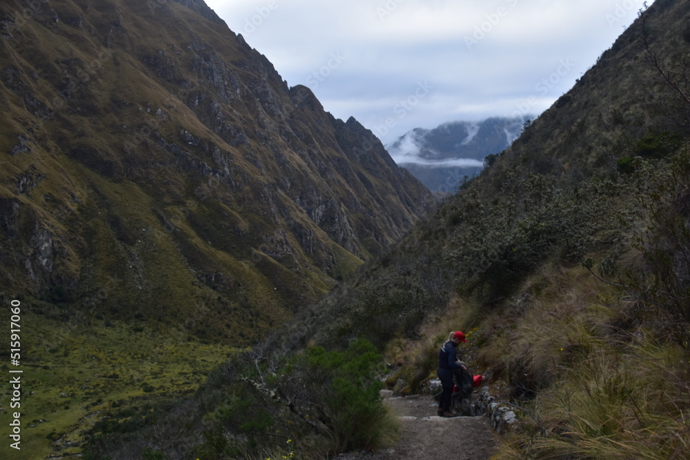 Hiking the green valleys and lush jungle and mountain landscape of the Inca Trail in Peru Hiking the green valleys and lush jungle and mountain landscape of the Inca Trail in Peru