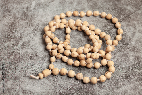 Rosary or prayer beads on a marble background.