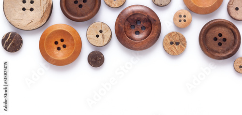 Button isolated on white background. Wooden buttons collection closeup