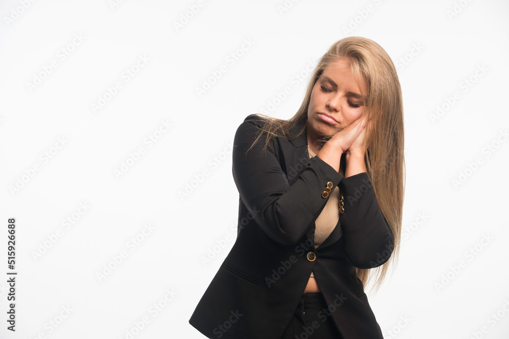 Young businesswoman in black suit looks dreamy Young businesswoman in black suit looks dreamy
