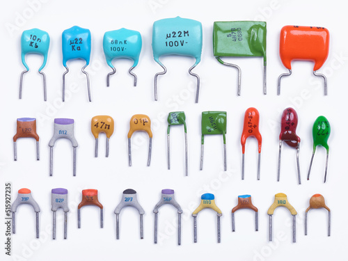 Wallpaper Mural Set of small capacitors. Different type in different colors. Colorful small ceramic, metal, film capacitors. Green, blue, orange, red capacitors. On white background. Top view. Torontodigital.ca
