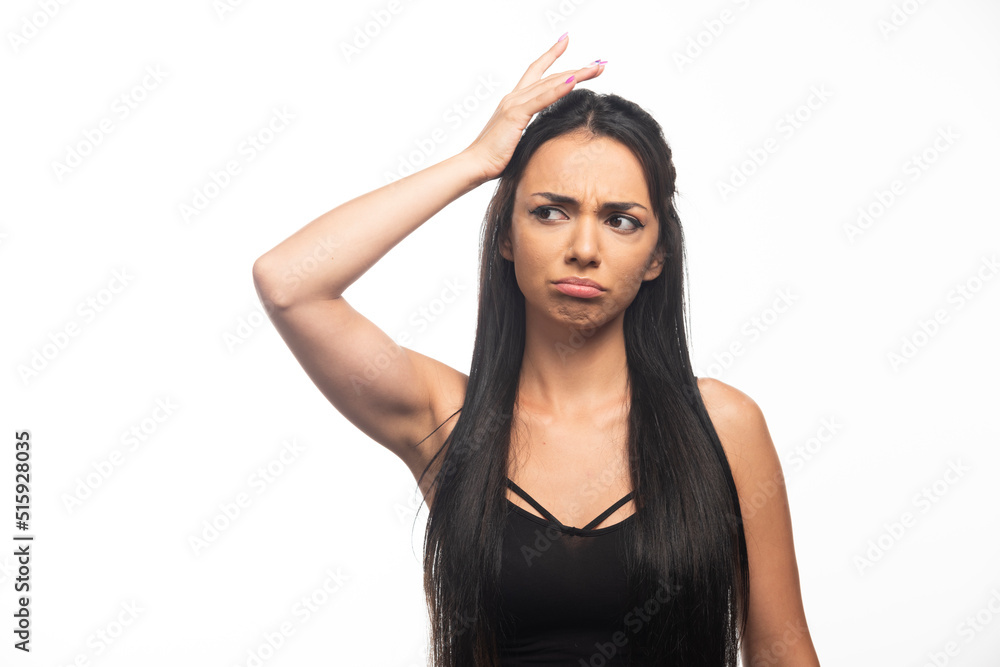 Portrait of young woman posing on white background Portrait of young woman posing on white background