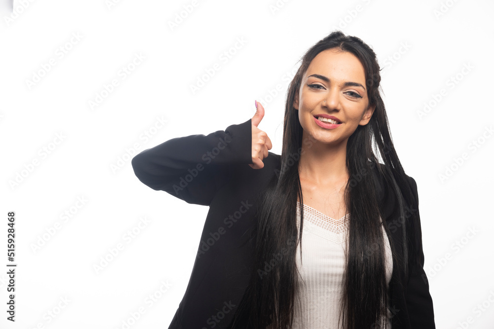 Business woman posing with thumb up on white background Business woman posing with thumb up on white background