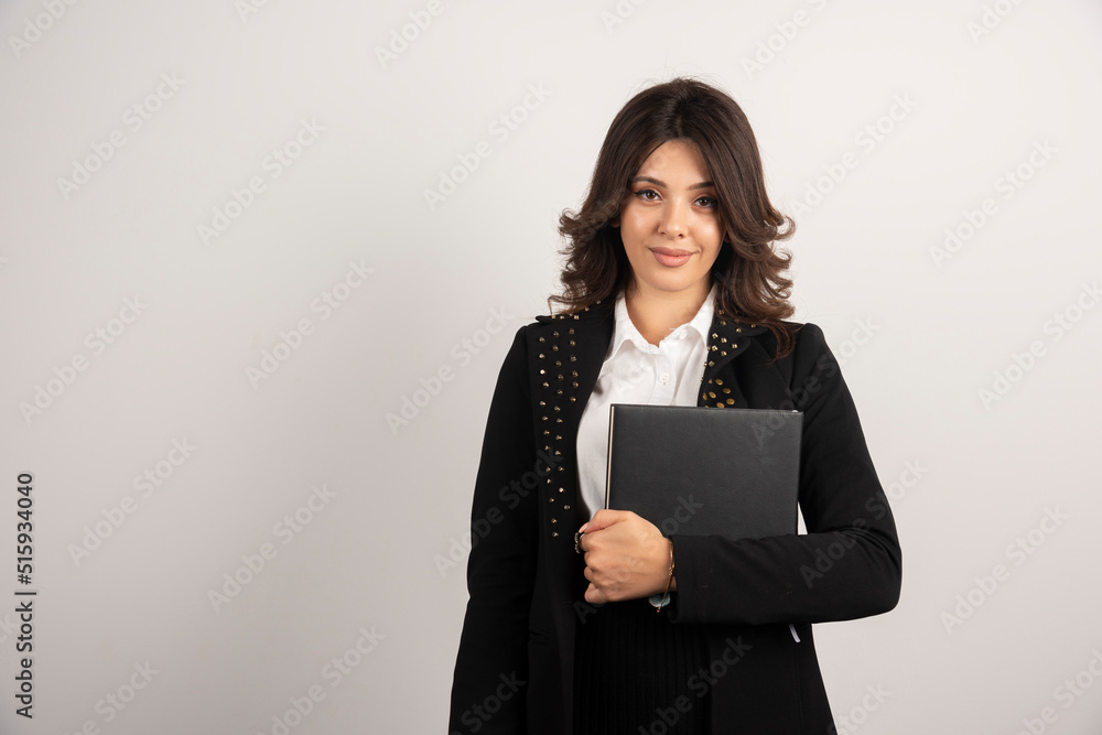 Young teacher holding book on white background Young teacher holding book on white background