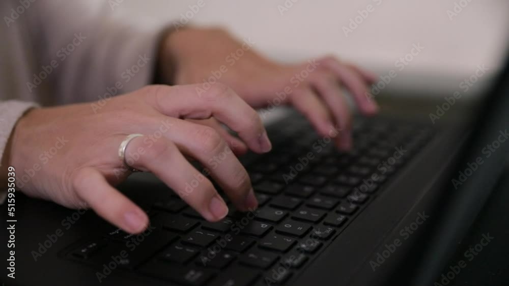 Home office. Closeup view of caucasian female hands typewriting with the laptop keyboard. Home office. Closeup view of caucasian female hands typewriting with the laptop keyboard.