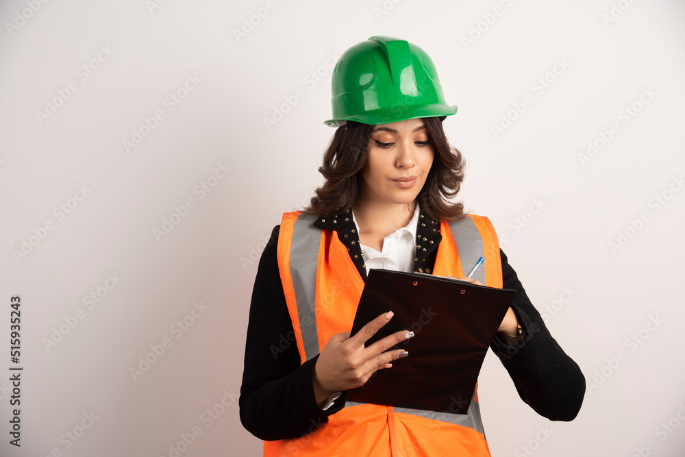 Woman engineer looking at important documents Woman engineer looking at important documents