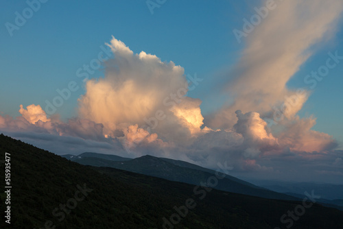 cirro-cumulus and cumulus clouds in the evening light at sunset in the mountains