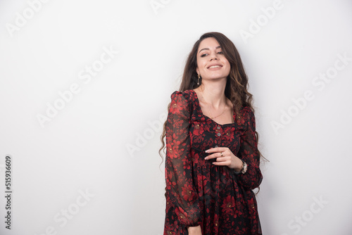 Portrait of long haired woman standing with happy expression