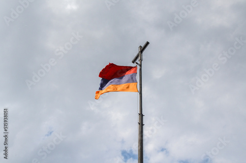 Armenia national flag waving on a cloudy sky background. Armenian symbol and patriotic concept 