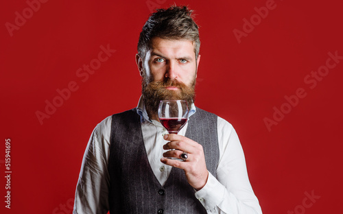 Fototapeta Sommelier with red wine in glass