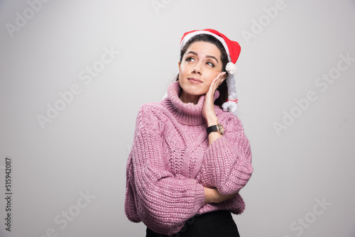 Young attractive girl holding her hand to her face