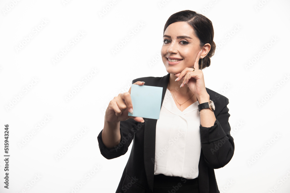 Female employee showing memo pad on white background Female employee showing memo pad on white background