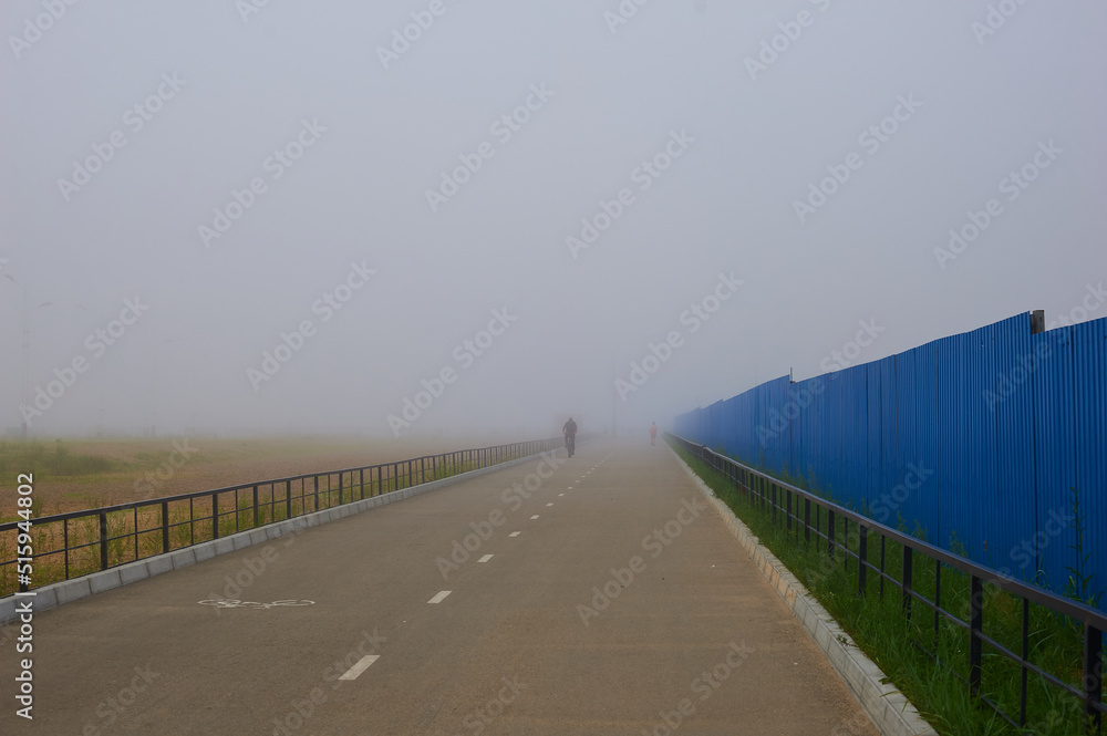 Morning fog on the bank of the Amur River in the city of Blagoveshchensk, Amur region.