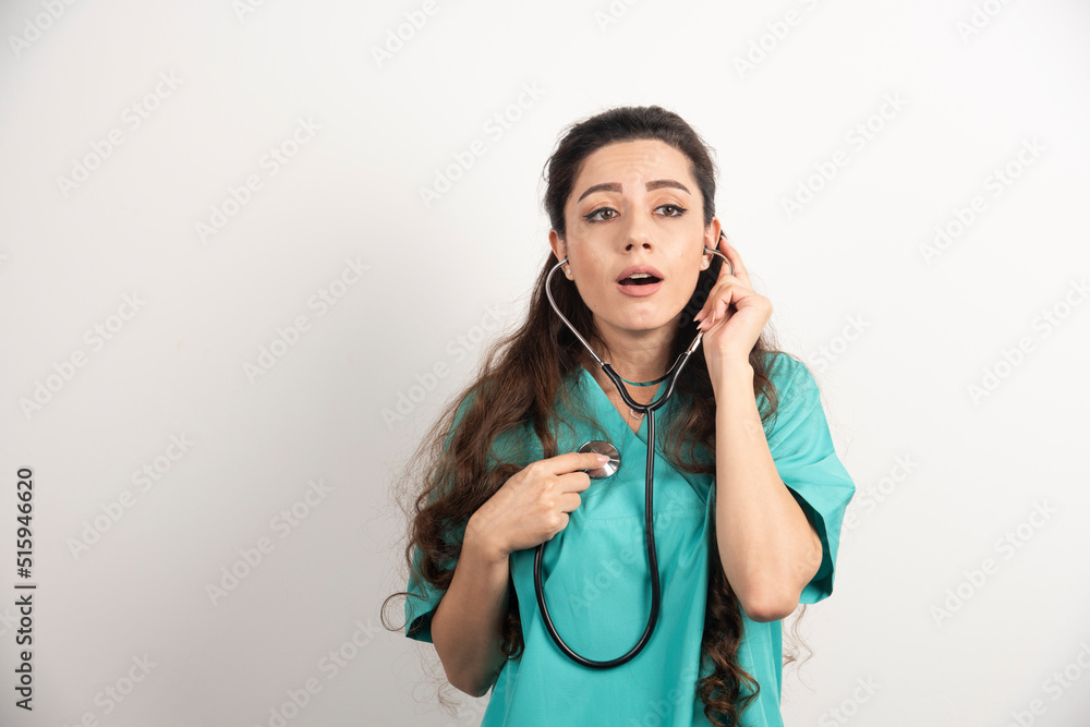 Young woman doctor in uniform with stethoscope Young woman doctor in uniform with stethoscope