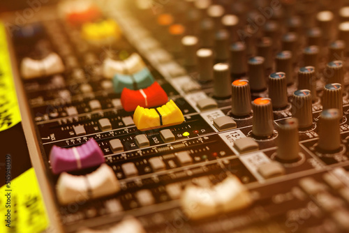 Sound equipment at a music studio. Faders on a sound mixer