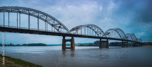 Centennial Bridge and dramatic cloudscape over the Mississippi River, the view from Centennial Park in Davenport, Iowa photo