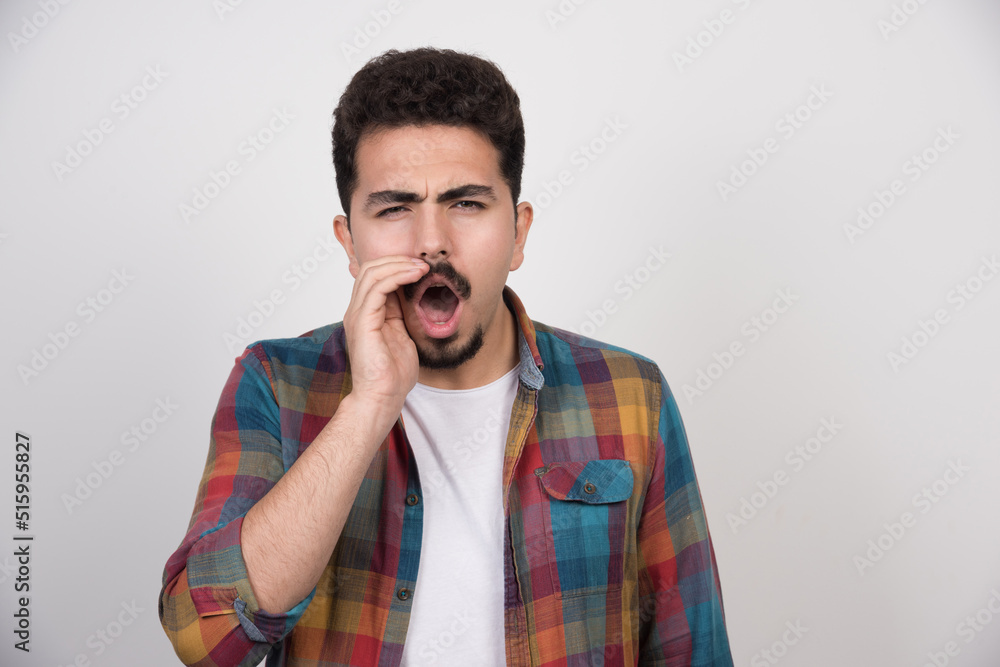 Young handsome guy calling for somene Young handsome guy calling for somene