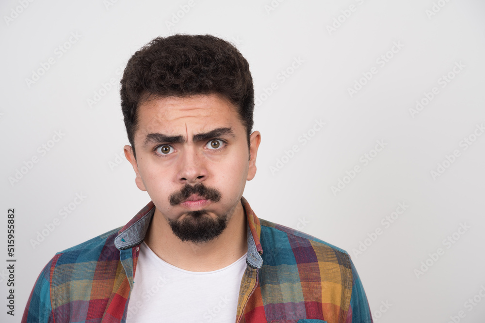 Closeup portrait of young angry man Closeup portrait of young angry man