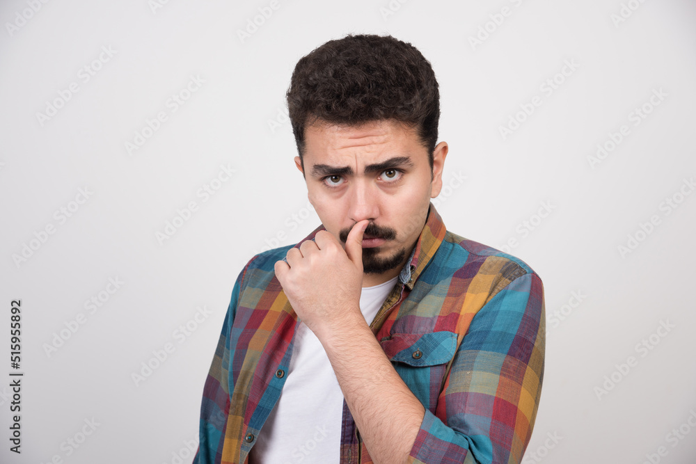 Confident guy giving sharp look to the camera Confident guy giving sharp look to the camera