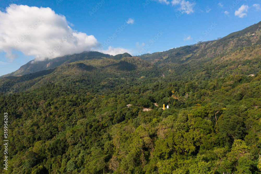 Top view of mountains covered with forest and jungle in the morning haze. Sri Lanka. Top view of mountains covered with forest and jungle in the morning haze. Sri Lanka.