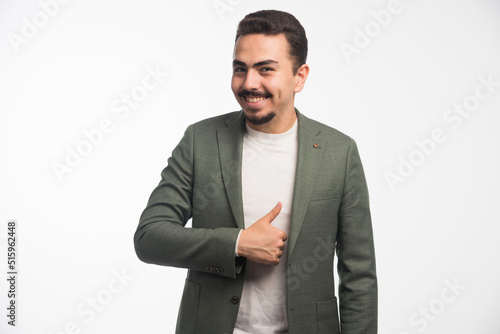 A businessman in dress code pointing a good job