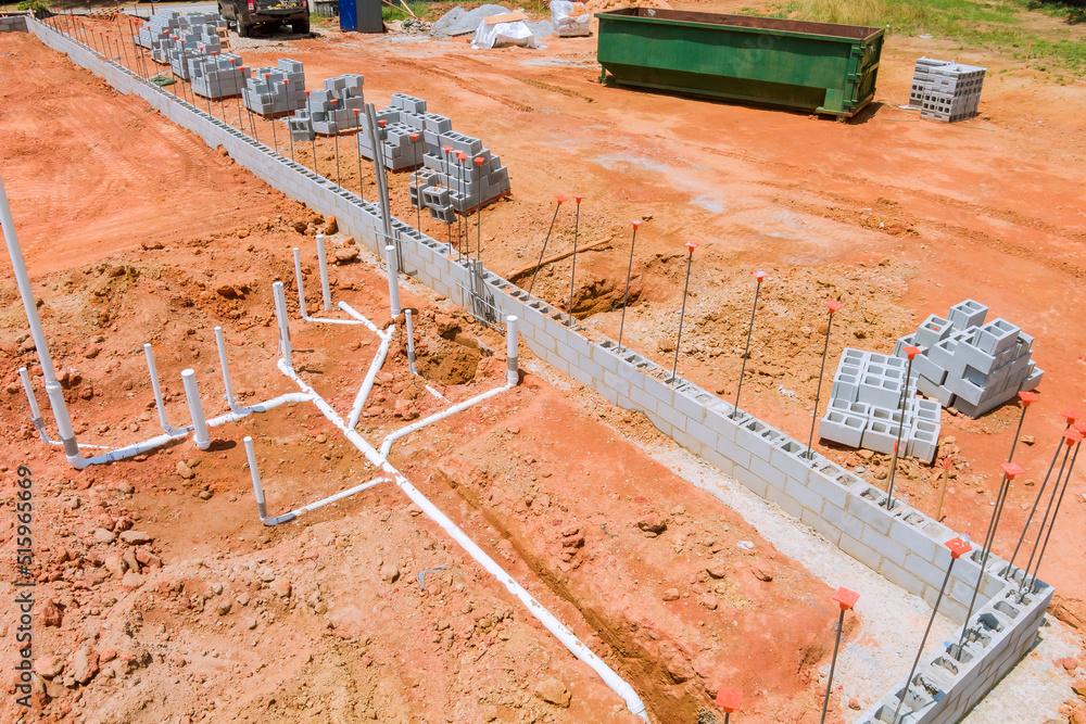 Laying sewer and water pipes under the foundation of a new residential