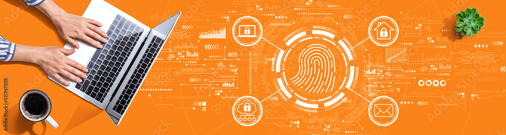 Fingerprint scanning theme with person using a laptop computer Fingerprint scanning theme with person using a laptop computer