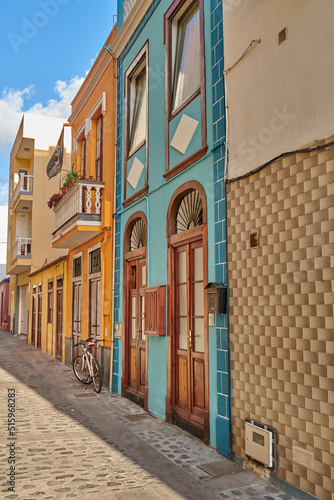 Scenic view of old historic houses, residential buildings, and traditional infrastructure in cobblestone city alleyways, streets, and roads. Tourism abroad and travel to Santa Cruz, La Palma, Spain
