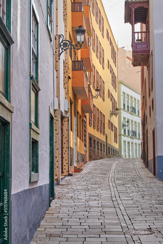 Scenic street view of old vibrant historic houses  residential buildings and traditional infrastructure in alleyway road. Tourism abroad  overseas travel destination in Santa Cruz de La Palma  Spain