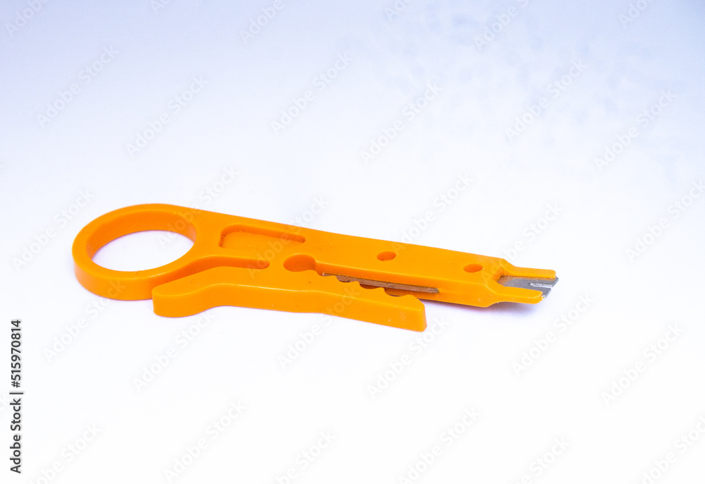 Close-up photo of yellow wire stripping and cutting tool isolated on white background Close-up photo of yellow wire stripping and cutting tool isolated on white background