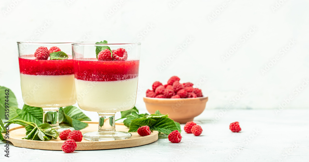 Raspberry sorbet with whipped cream and mint. Italian dessert on a light background in small jars. Long banner format. place for text Raspberry sorbet with whipped cream and mint. Italian dessert on a light background in small jars. Long banner format. place for text