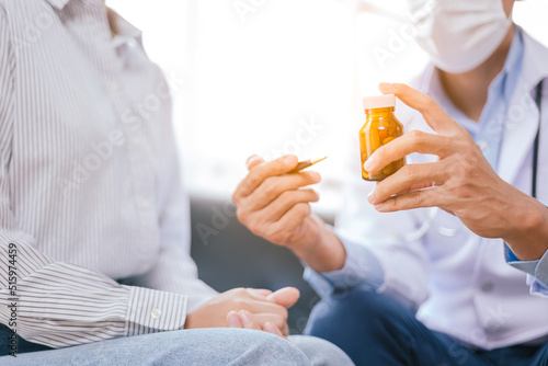 Close up of doctor's hands is explaining and advising about using pills and treatment to patient.
