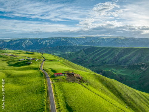 Fototapeta Naklejka Na Ścianę i Meble -  a country road in mountains 