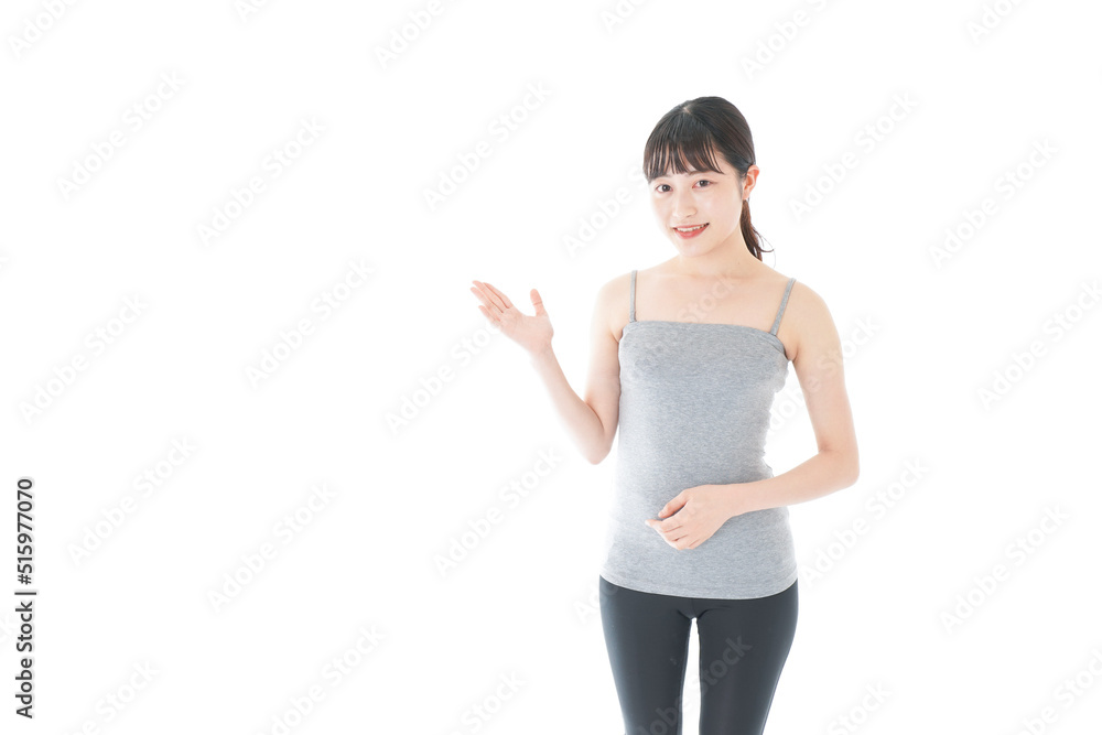 Young woman pointing something with sports wear Young woman pointing something with sports wear
