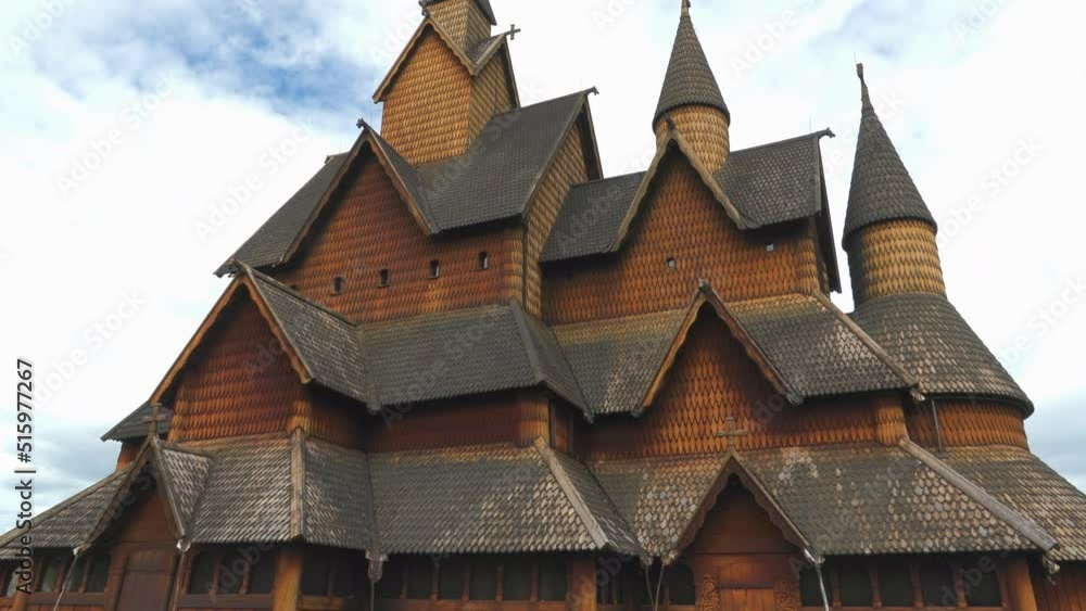 heddal stave church wood cathedral built 1300 century triple nave tilt up cloudy sky norway heddal stave church wood cathedral built 1300 century triple nave tilt up cloudy sky norway