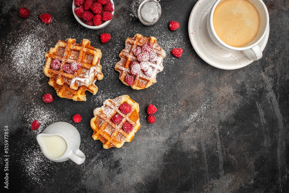 Belgian waffles with raspberries with sugar powder. Traditional belgian waffles with fresh fruit. banner, menu, recipe place for text, top view. Delicious breakfast or snack