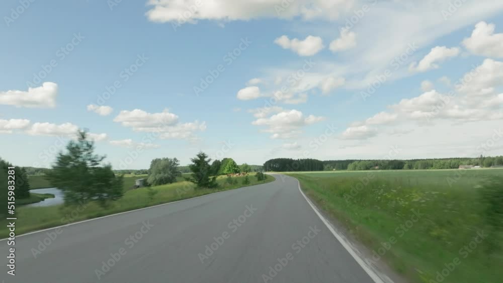 Point of View POV of car driving on scenic rural road in summer Point of View POV of car driving on scenic rural road in summer