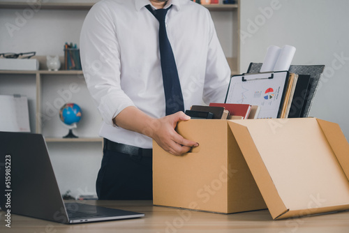 Quitting a job,The big quit. The great Resignation. Resignation. Businessmen hold boxes for personal belongings and resignation letters..