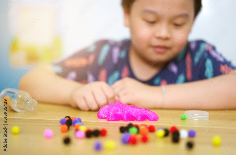 kid play slime on table kid play slime on table