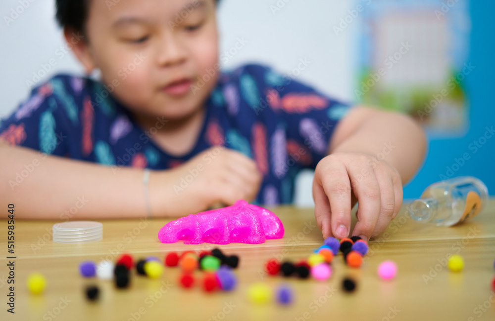 kid play slime on table kid play slime on table
