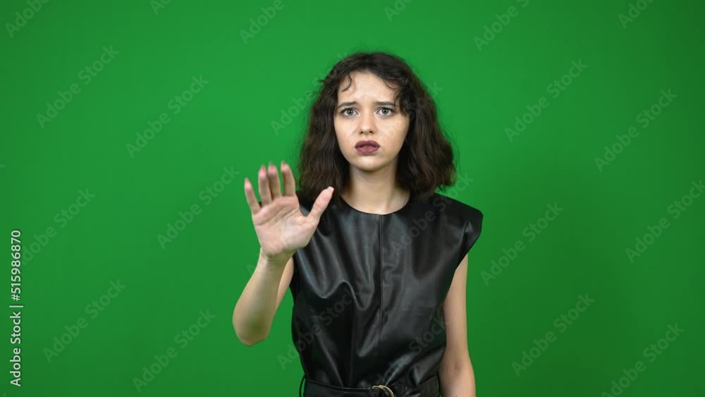 Young elegant woman showing hello gesture Young elegant woman showing hello gesture