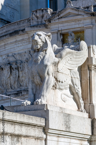 Statue of winged lion in frint of Victor Emmanuel II Monument on Venetian Square, Rome, Italy