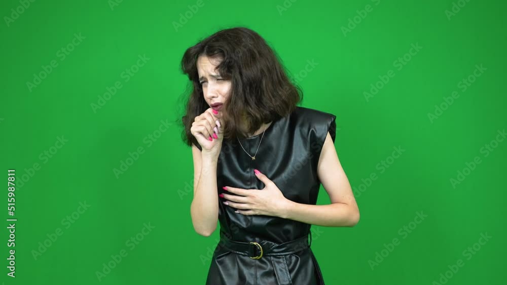 Young female model feeling sick and coughing