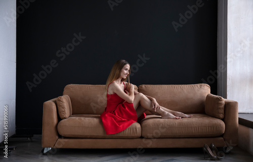 studio portrait on a dark background of a beautiful young woman